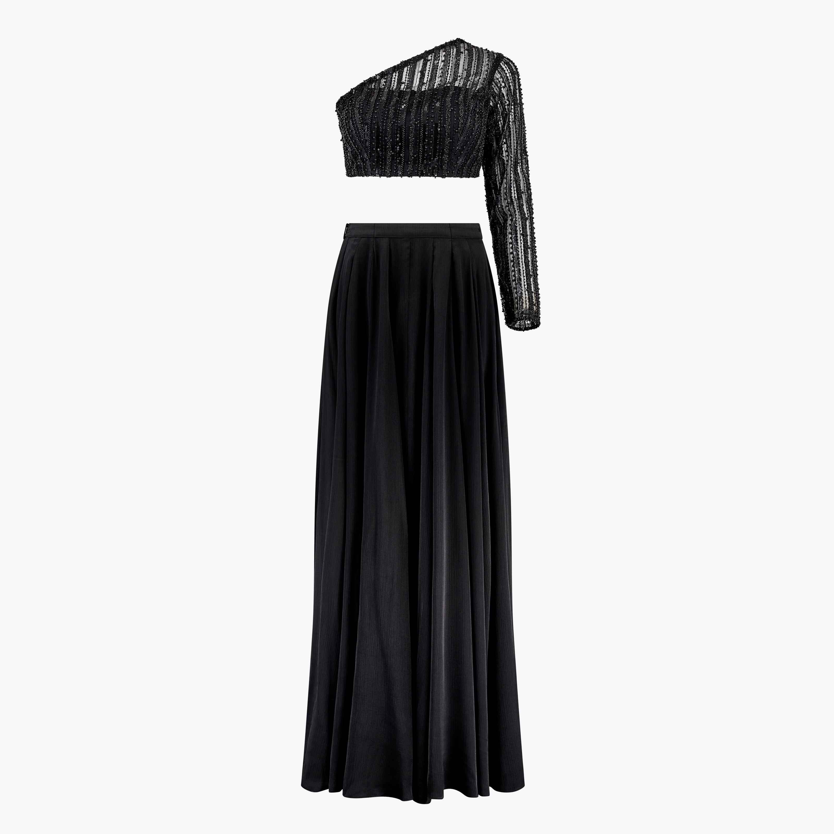 A black two-piece formal wear ensemble with bead work embroidery on the top and a georgette/satin lehenga. Designed by Shenena Sethi