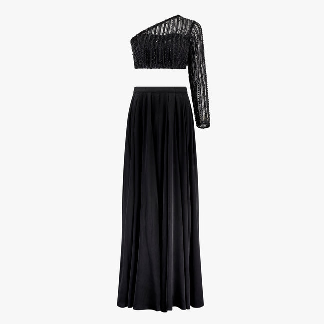 A black two-piece formal wear ensemble with bead work embroidery on the top and a georgette/satin lehenga. Designed by Shenena Sethi