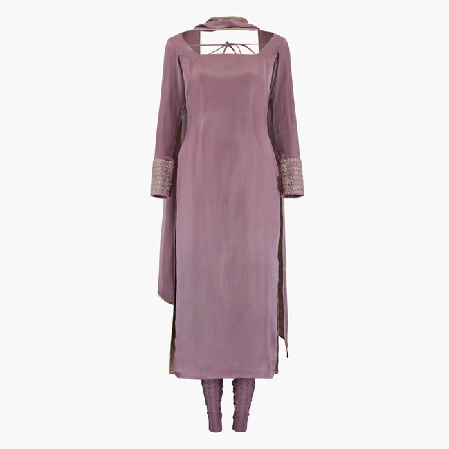 A mauve-colored kameez and dupatta and pajami set with mirror work on the cuff and a dupatta, designed by Shenena Sethi