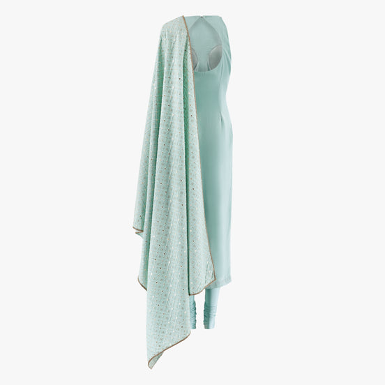 a suede georgette mix fabric kameez complimented with a chikan kari dupatta and lycra pajami designed by Shenena Sethi