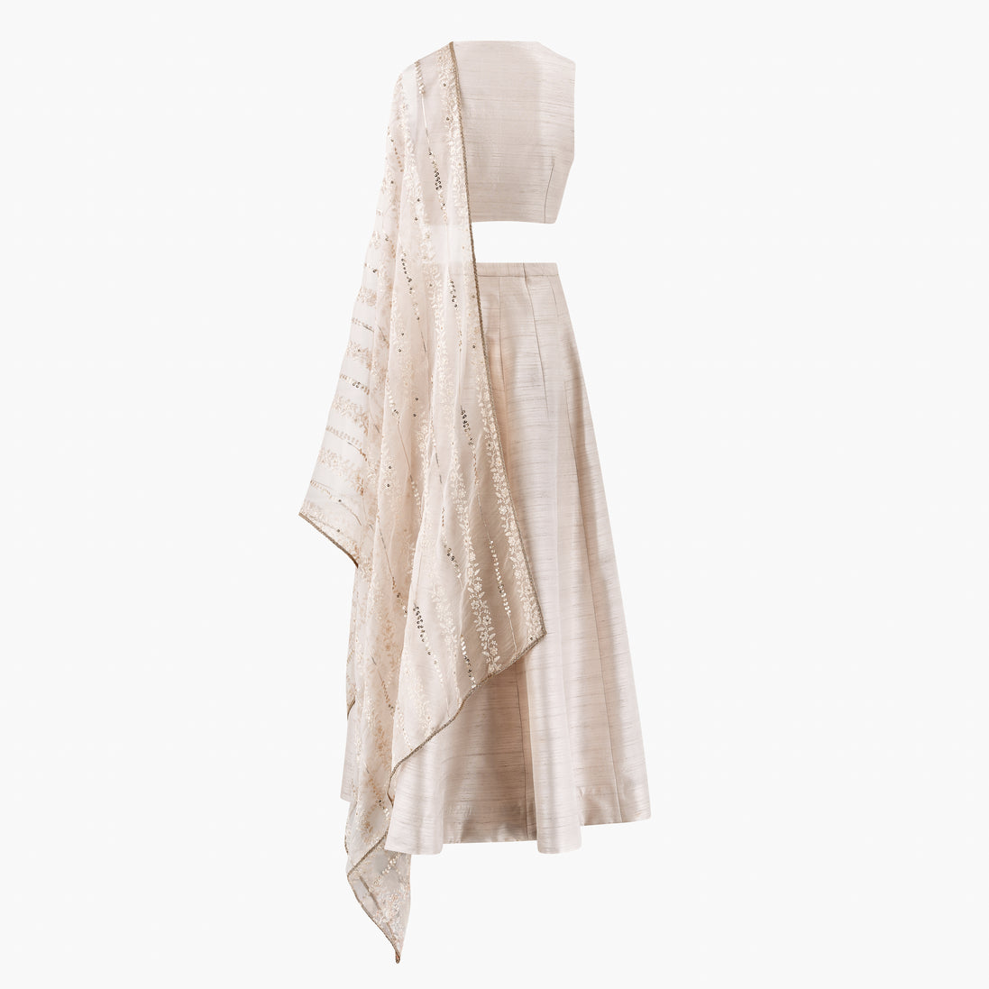 A cream-colored semi raw silk lehenga and top featuring an organza thread and sequin dupatta, designed by Shenena Sethi