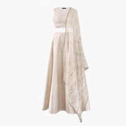 A cream-colored semi raw silk lehenga and top featuring an organza thread and sequin dupatta, designed by Shenena Sethi