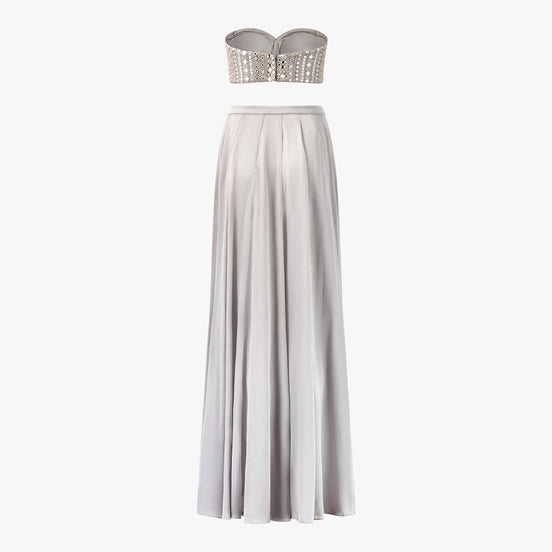 A grey two-piece formal lehenga and top with a mirror and chikan kari boob tube top and a long satin lehenga, designed by Shenena Sethi