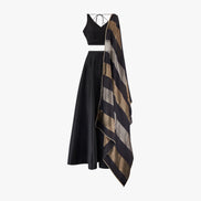 A traditional Indian semi raw silk lehenga and top paired with a chanderi tissue block dupatta in black, silver, and gold colours, designed by Shenena Sethi
