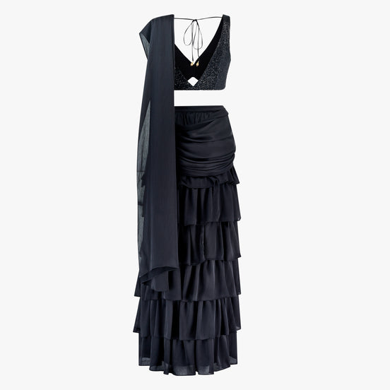 A black traditional outfit with sequin blouse and layered skirt with dupatta, designed by Shenena Sethi