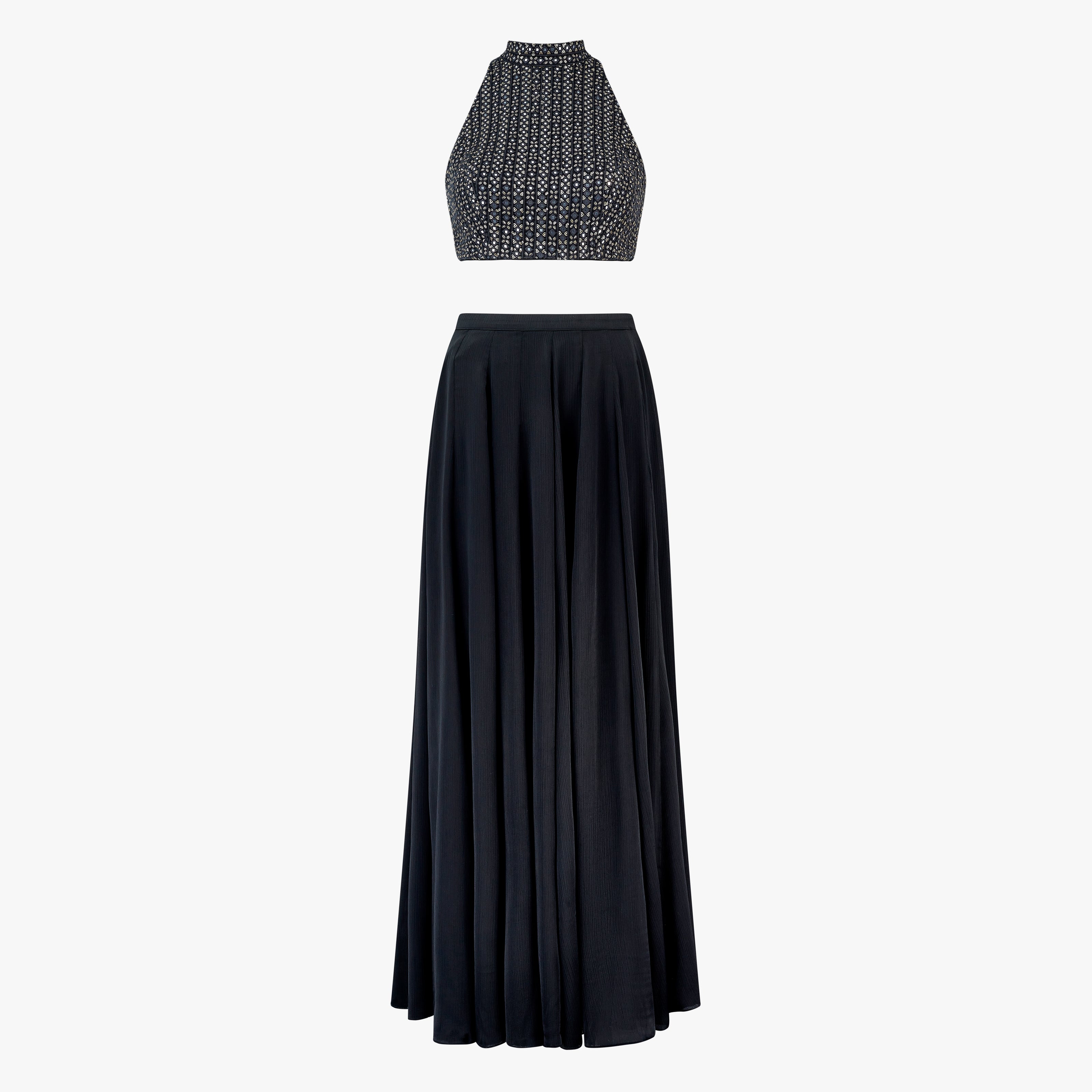 Lyla, a two-piece outfit with a mirror and thread work blouse and a georgette satin skirt in black, designed by Shenena Sethi