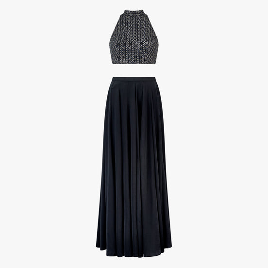 Lyla, a two-piece outfit with a mirror and thread work blouse and a georgette satin skirt in black, designed by Shenena Sethi