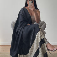 A luxury silk kameez in grey and black with a satin/silk dupatta featuring mirror work. The kameez is paired with a Lycra pajami, designed by Shenena Sethi