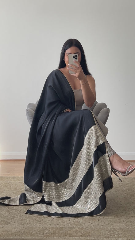 A luxury silk kameez in grey and black with a satin/silk dupatta featuring mirror work. The kameez is paired with a Lycra pajami, designed by Shenena Sethi