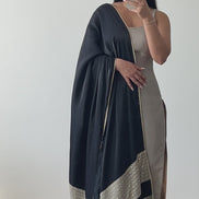A luxury silk kameez in grey and black with a satin/silk dupatta featuring mirror work. The kameez is paired with a Lycra pajami, designed by Shenena Sethi