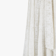 Chikan kari lehenga designed by Shenena Sethi, intricately embroidered with sequins and a plain semi raw silk top